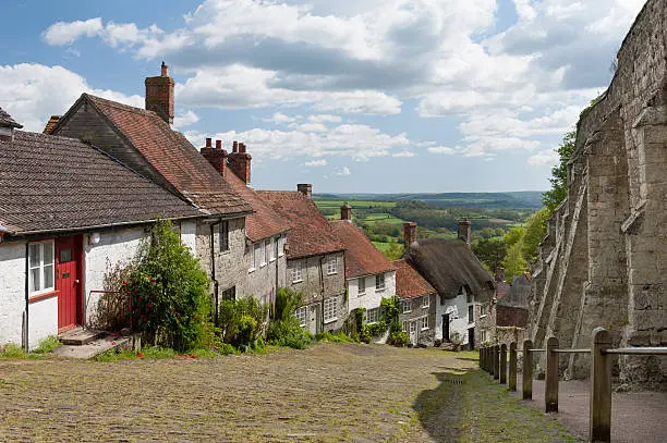 The famous Gold Hill, in Shaftesbury, North Dorset. Location for the making of the Hovis bread advert. Taken in the summer months with light cloud and good visibility.