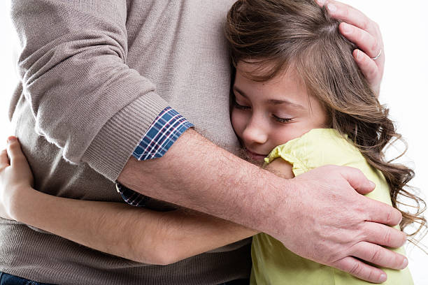 istock parent holding her daughter 637918138