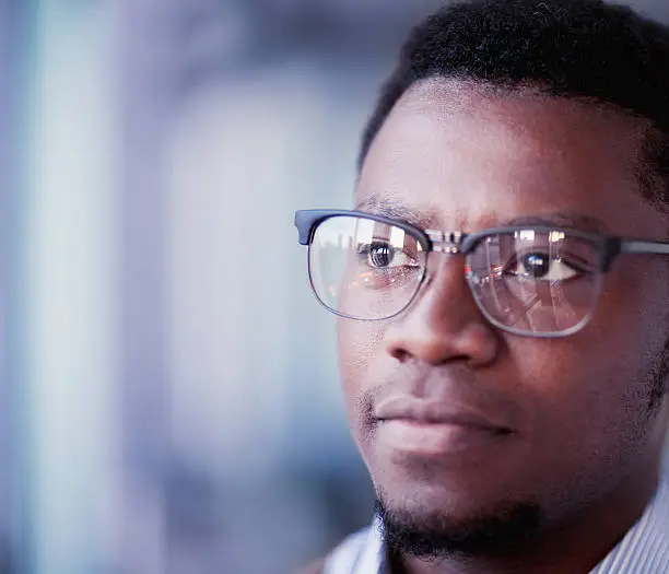 Photo of Portrait of young man looking ahead in office