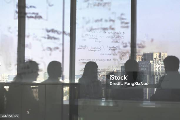 Silhouette Shadows Of Business Team Meeting In Office Stock Photo - Download Image Now