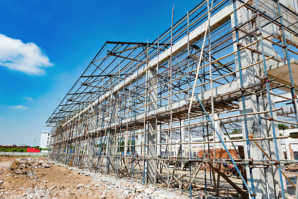 istock Demolition of an old building under blue sky 637923442