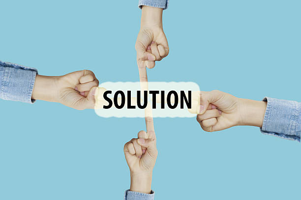 istock Many hands fingers pointing with index fingers to SOLUTION text 637924946
