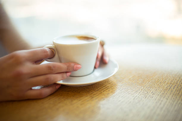 istock Lady's hands holding cup of coffe 637926882