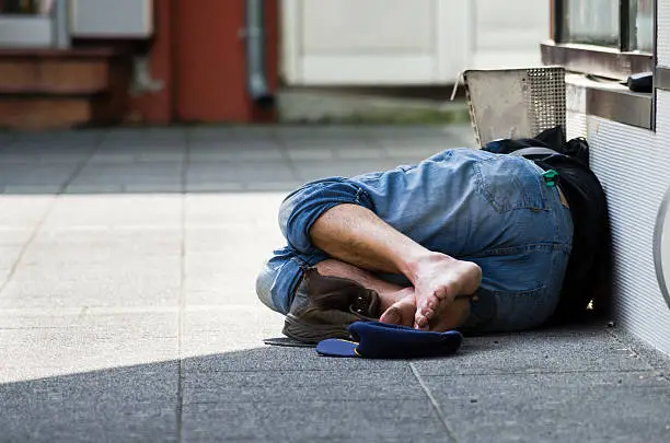 Photo of Homeless. Homeless man sleeps on the street