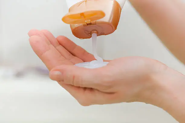Photo of closeup of liquid soap in a hand