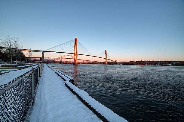 istock winter view of river and riverside at sunset 637930088