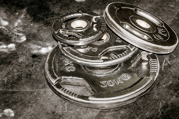 istock Weights on the gym floor. Workout equipment. 637930884