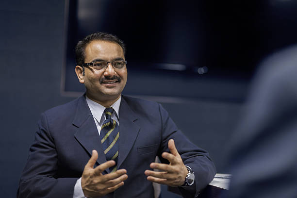 istock Executive businessman talking in meeting room 637933278