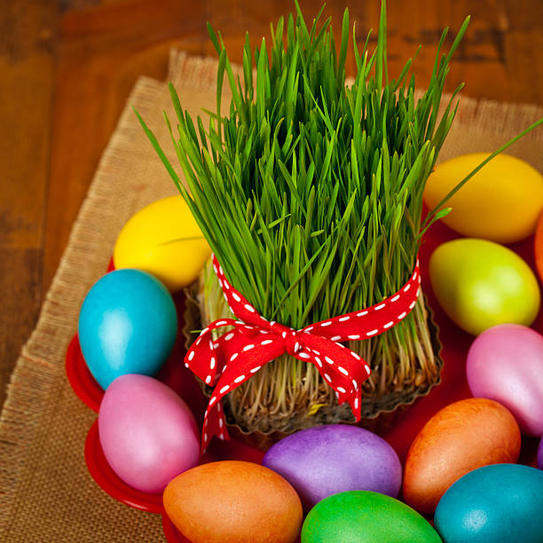 Colored eggs, wheat springs Nowruz Holiday in Azerbaijan. Selective focus.