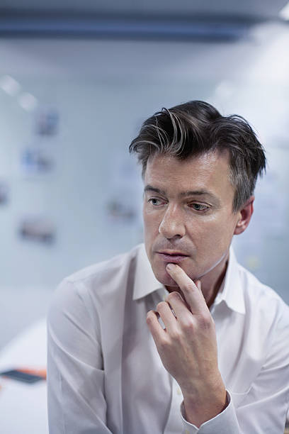 istock Portrait of man thinking in design studio office 637937182