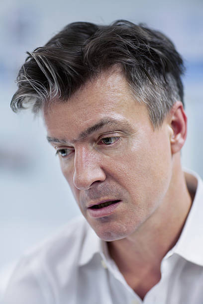istock Portrait of man with blank expression in design studio office 637937248