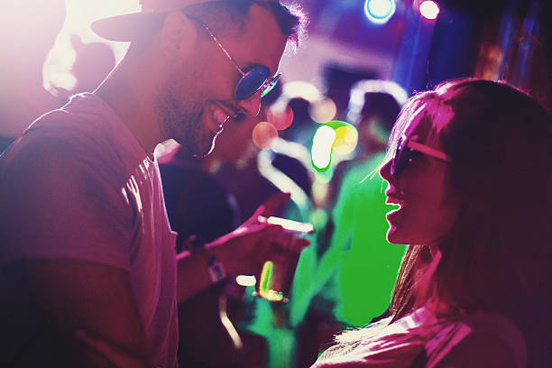 istock Couple at a party. 637937956