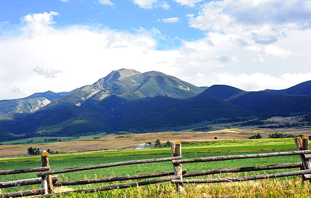 istock Absaroka Mountains Loom Over Farm 637938328