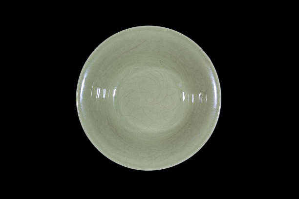 istock Soup green plate on black background from above 637939272