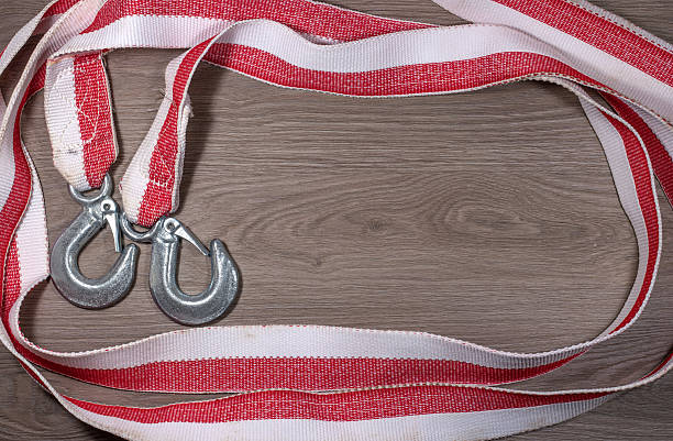 istock Tow rope for a car on wood background. 637939292