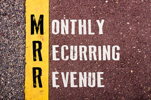 MONTHLY RECURRING REVENUE , words concept on Asphalt with Yellow Dividing Line.