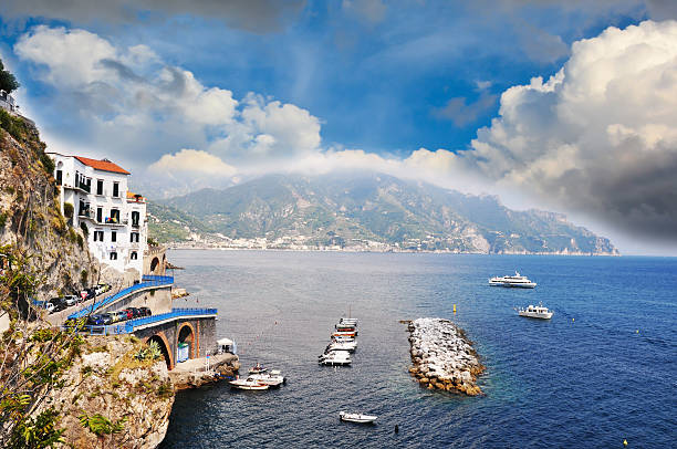 vessels sailing along the coast in Praiano, Amalfi Coast Small vessels sailing along the coast line in Praiano, Amalfi Coast - Italy praiano photos stock pictures, royalty-free photos & images