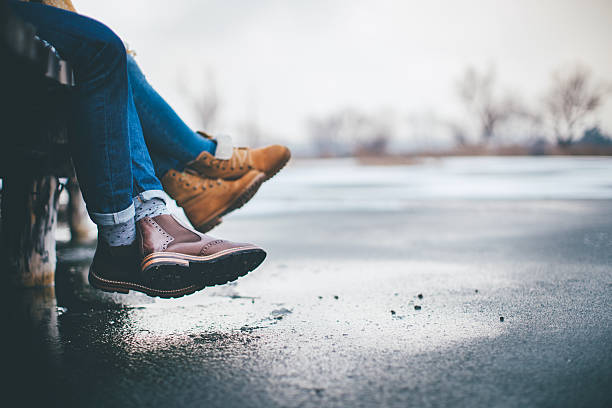Couple on cold winter day in nature, having fun