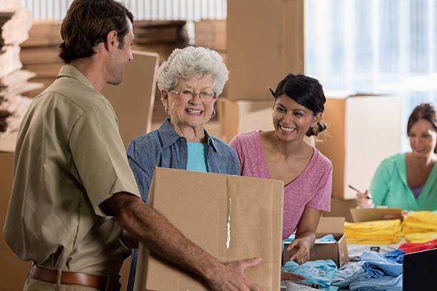 istock Delivery man makes delivery to small business owners 637946000