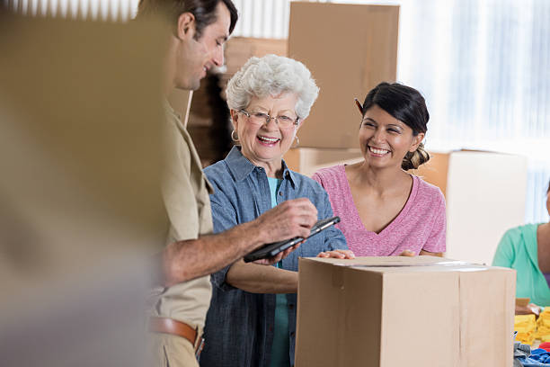 istock Caucasian delivery man picks up packages from small business owners 637946100