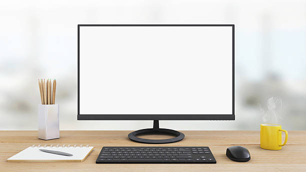 istock Large PC monitor on an office desk 637947520