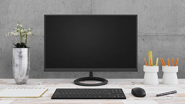 istock Large PC monitor on an office desk 637947528