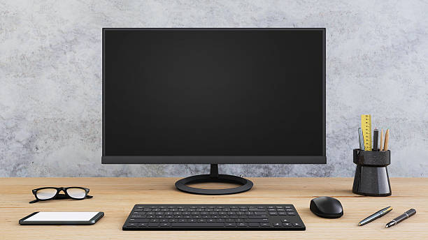 istock Large PC monitor on an office desk 637947626