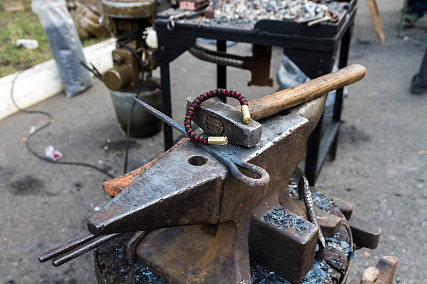 istock Anvil, bracelet and hammer. 637948102