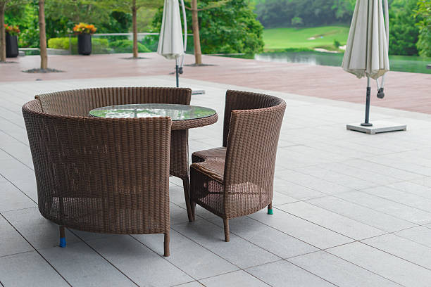 istock rattan sofa and table set in a garden 637949762