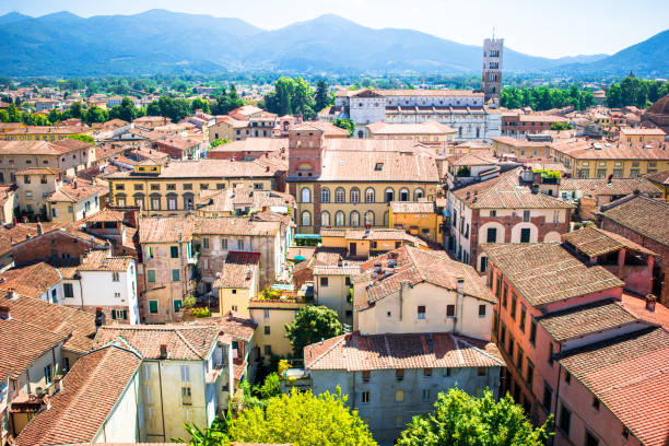 istock Beautiful view of ancient building with red roofs in Lucca, 637949810