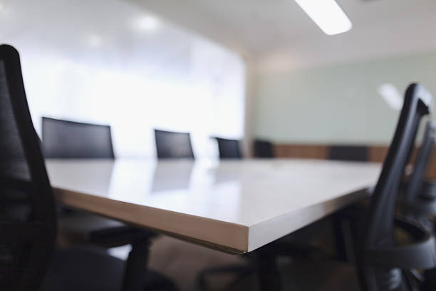 Corner of business conference room table and chairs