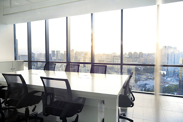 istock View of office conference room with sunset in windows 637951816