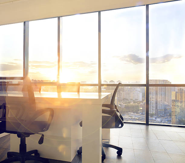 istock View of office conference room with sunset light in windows 637951858