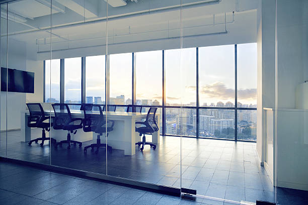 istock View of office conference room with sunset light in windows 637951964