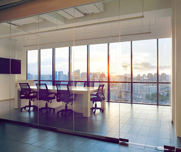 istock View of office conference room with sunset light in windows 637951980