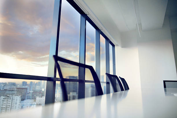 istock Conference table and chairs in modern office at sunset 637952062