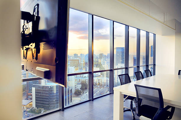 istock Conference table and chairs with wall monitor in modern office 637952106