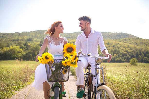 istock Happy couple riding bicycles outside, 637955212
