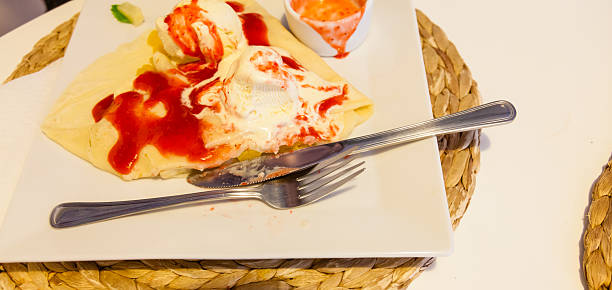 istock Pancake with ice cream and strawberry sauce 637955506