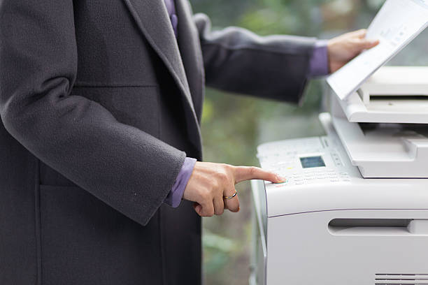 istock young asian woman with finance report using copier in office 637956918