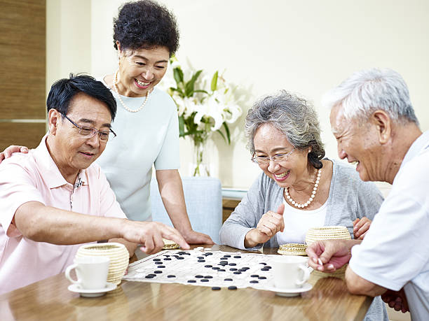istock senior asian people playing weiqi 637961814