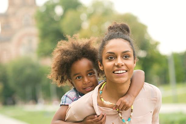 istock Mother and daughter enjoying having fun at the park. 637963012
