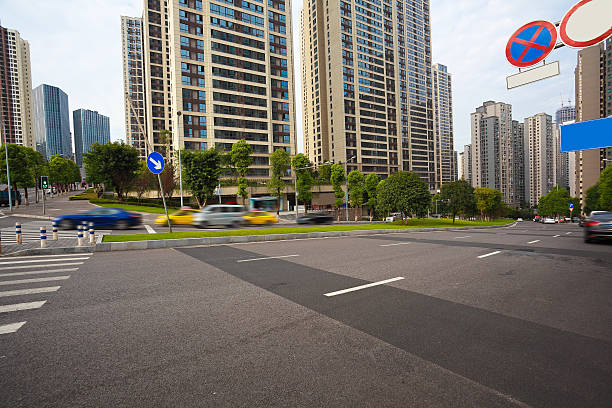 istock Empty road surface floor with City streetscape buildings 637963584