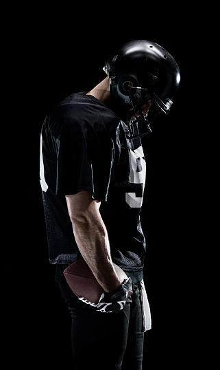 American football player looking down