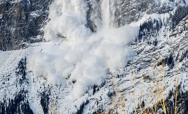 An avalanche occuring in the Rocky Mountains, near Canmore, Alberta