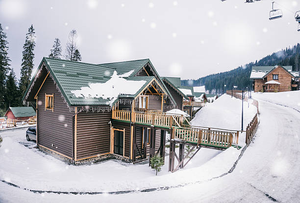 Comfortable wooden cottage in the ski resort Polyanytsya village, Ivano-Frankivsk oblast, Ukraine - November 28, 2014: Residential wooden cottages, ski resort "Bukovel" in the Carpathians, Ivano-Frankivsk oblast, Ukraine. The development of winter sports in Eastern Europe. Modern comfortable accommodation at the ski resort bukovel ski resort ukraine stock pictures, royalty-free photos & images