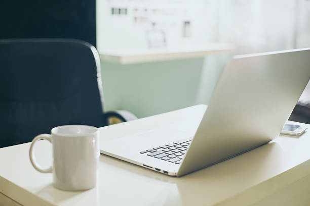 istock Modern and stylish laptop on a table in the office, 637970372