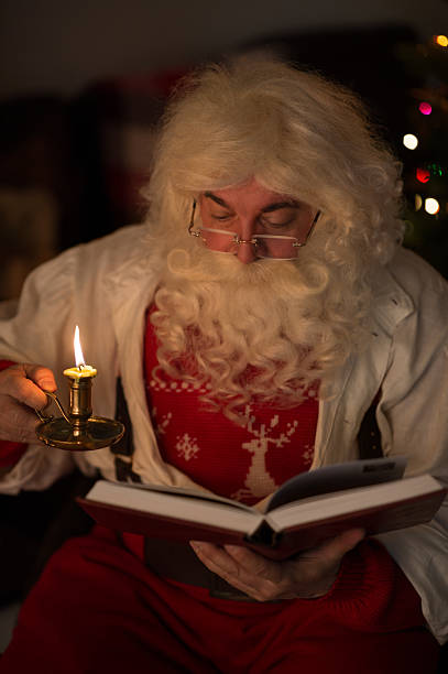 istock Santa Claus reading at Home 637974836