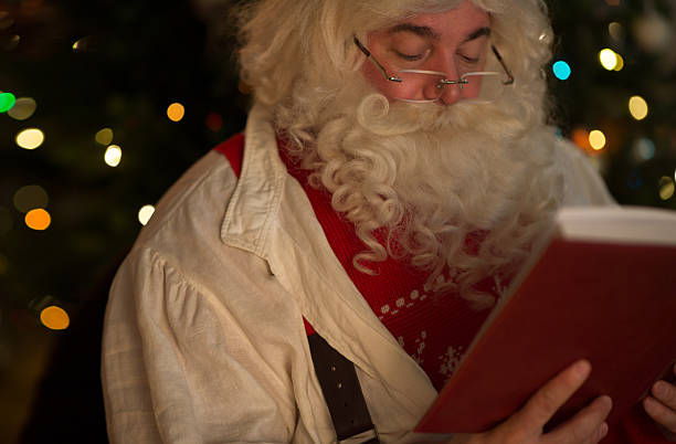 istock Santa Claus reading at Home 637974930