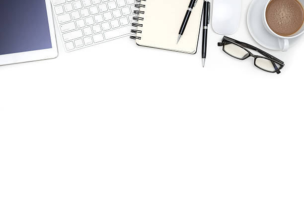 istock Office supplies with computer tablet on white desk 637975224